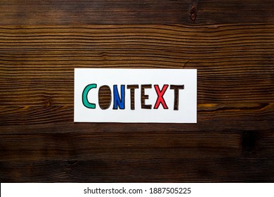 Context marketing concept. Word Context on paper banner, top view