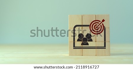 Contextual advertsing and targeting concept. Digital marketing strategy and social network advertsing. Personalized marketing. Wooden cubes with goal and contextual advertising icon on grey background