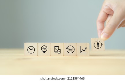 Contexual marketing concept. Customer behavior data analysis. Personalized marketing strategy with data driven. Hand holds wooden cubes with personalization icon standing with customer behaviors. - Shutterstock ID 2111594468