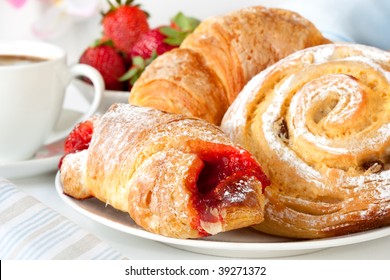 Continental Breakfast With Assortment Of Pastries, Coffees And Fresh Strawberries.