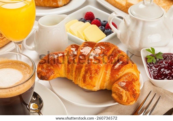 Continental breakfast with croissants, orange juice\
and coffee or tea