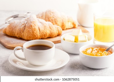 Continental breakfast with fresh croissants, orange juice and coffee, selective focuse. - Shutterstock ID 1062875051