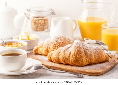 Continental breakfast with fresh croissants, orange juice and coffee, selective focuse. - Powered by Shutterstock