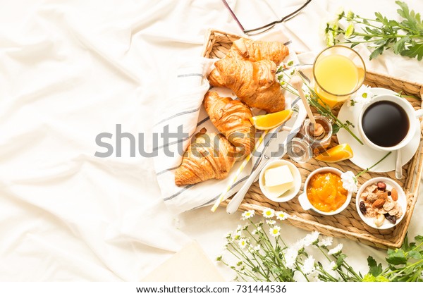 Continental Breakfast On White Bed Sheets Stock Photo Edit Now 731444536