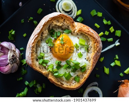 Similar – Image, Stock Photo Bread buns in a basket hanging on a blue wall