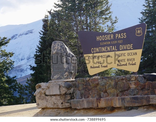 Continental Divide sign of the U.S. Department of\
Agriculture’s Forest Service at Hoosier Pass in central Colorado at\
an elevation of 11,539 feet. The marker divides Atlantic Ocean and\
Pacific Ocean.