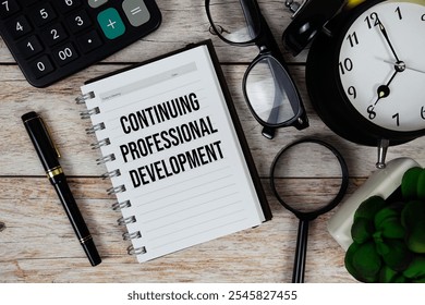Continuing Professional Development (CPD) text on notepad, Business and Financial concept background