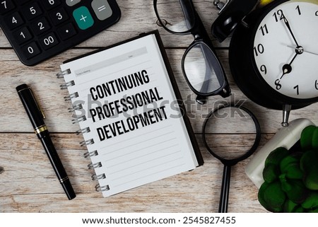 Continuing Professional Development (CPD) text on notepad, Business and Financial concept background