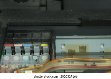 Continuous Ink Supply System Is Working In Printer Moving Inside, Closeup View. Printing New Inkjet Printer For Launch, CISS. Small Printer For Use And Printing At Home, Filled With Only Black Paint.