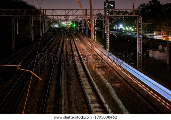 continuous light\
of a passing train at night\
city