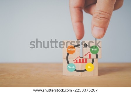 For continuous quality improvement model of four key s stages ( Plan, Do, Check, Action or  PDCA), efficiency concept. Solving problems, improving organizational process. Hand complete wood cube block