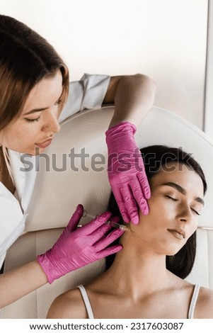 Contour plastic for correcting the volume and shape of the cheekbones. Filler injection of hyaluronic acid in cheekbones