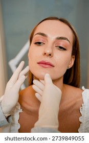 Contouring of the chin and angular jaws. Correcting the shape of the face by doctor. Aesthetic beauty treatment. Improved shape of the face.