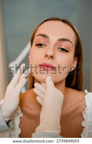 Contouring of the chin and angular jaws. Correcting the shape of the face by doctor. Aesthetic beauty treatment. Improved shape of the face.