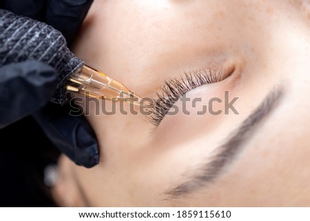 Contouring woman eye with permanent make-up, black eyeliner line.