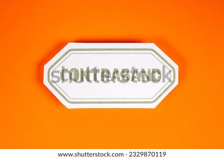 Contraband. Sticky note with text on an orange background.