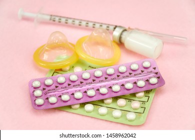 Contraception Education Concept With Oral Contraceptive, Injection Contraceptive And Male Condom.