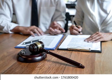 Contract decree of divorce (dissolution or cancellation) of marriage, husband and wife during divorce process and signing of divorce contract, Wedding ring.