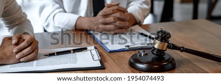 Contract decree of divorce (dissolution or cancellation) of marriage, husband and wife during divorce process and signing of divorce contract, Wedding ring.