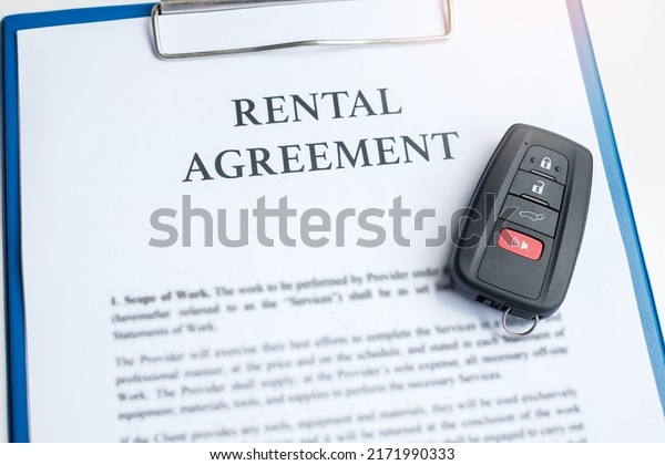 contract document with
car and remote key. buy and sale, insurance, rental and contract
agreement concepts