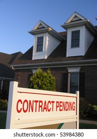 Contract Pending Sign In Front Of A New House