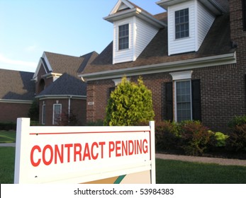 Contract Pending Sign In Front Of A New House