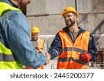 Contractor. construction worker team hands shaking after plan project contract  at construction site, contractor, engineering, partnership, construction concept