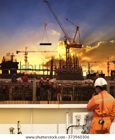 contractor and construction worker working in building construction site