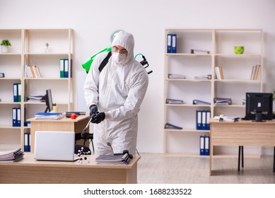 Contractor disinfecting office for COVID-19 coronavirus - Shutterstock ID 1688233522