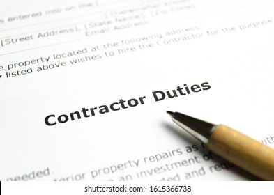Contractor duties with wooden pen - Shutterstock ID 1615366738