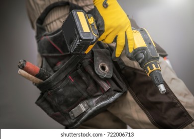 Contractor With Power Tool. Construction Worker With Drill Driver Pro Tool In Hand. Closeup Photo. Preparing For The Job.