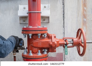 Contractor Technician Install Fire Sprinkler System. In The Industrial Plant, Pipe Assembly With Water, Red Fire Pipe, Fire Protection Suppression Contractors Test Maintenance Work In Office Safety