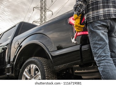 Contractor With Tools And His Truck. Closeup Photo. Construction Theme.