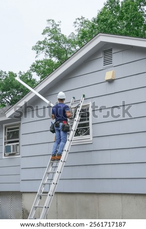 contractor working on replacing the window of the house