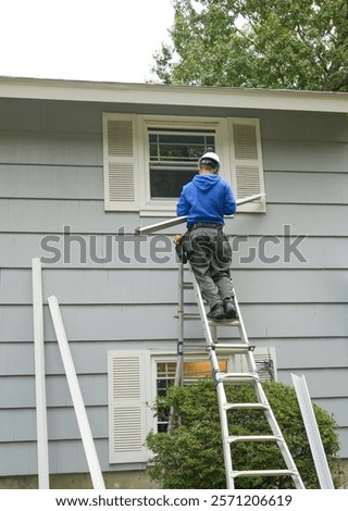 contractor working on replacing the window of the house