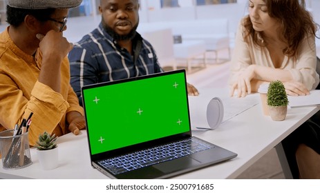 Contractors team showing office space sketch next to isolated chroma key, reviewing blueprint plans with a client. Real estate experts securing a contract after reaching a rental agreement. Camera A. - Powered by Shutterstock