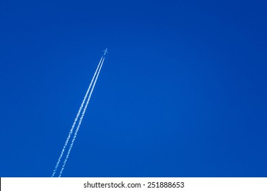 Contrail In Blue Sky. Plane, Clear Sunny Sky Background
