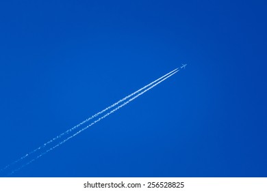 Contrail In Blue Sky. Plane, Clear Sunny Sky Background