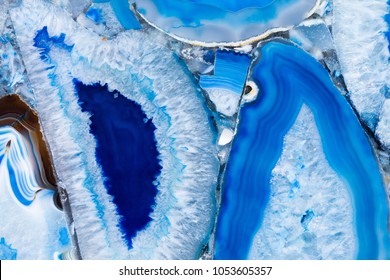 Contrast agate texture with delightful ornamental blue surface. High resolution photo.