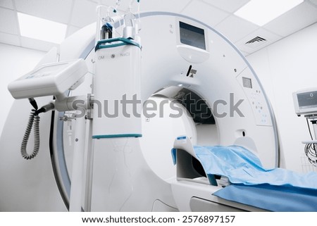 Contrast agent and CT scanner before diagnostics in the room. The concept of using modern technologies for accurate vascular examinations and disease diagnostics.
