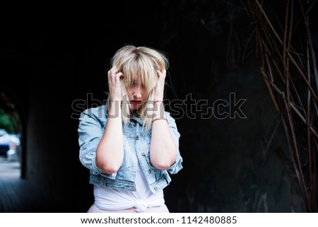 Similar – Young blonde woman with a headache