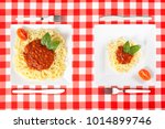 Contrasting large and tiny food portions of Spaghetti