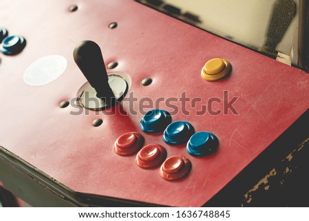 control buttons of an arcade machine in photography close up. Red color.
