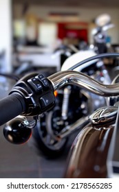 Control Buttons On A Chrome Motorcycle Handlebar At Motorbike Showroom