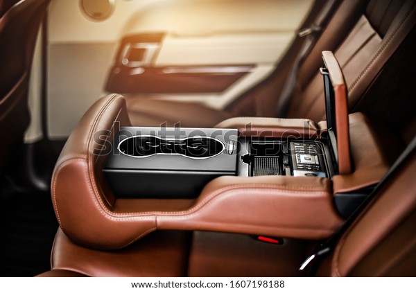 Control clima panel for rear seat\
passenger in the luxury car interior with leather\
seats.