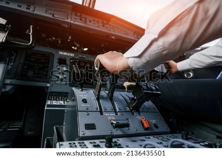Control of the flight. Pilot on the work in the passenger airplane. Preparing for takeoff.