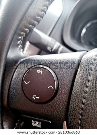 Control music playback using the steering wheel controls.