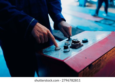 Control panel buttons, hands operating machine, industrial control, close up, manual switch, machinery