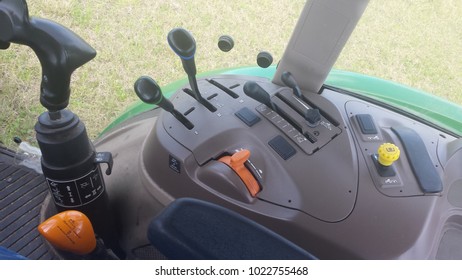 control panel inside a john deer tractor cabin 