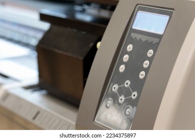 Control panel of large format inkjet printer. Selective focus.